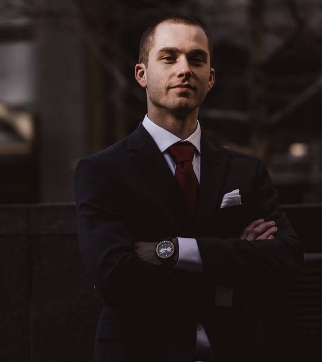 man-wearing-black-notched-lapel-suit-jacket-in-focus.jpg